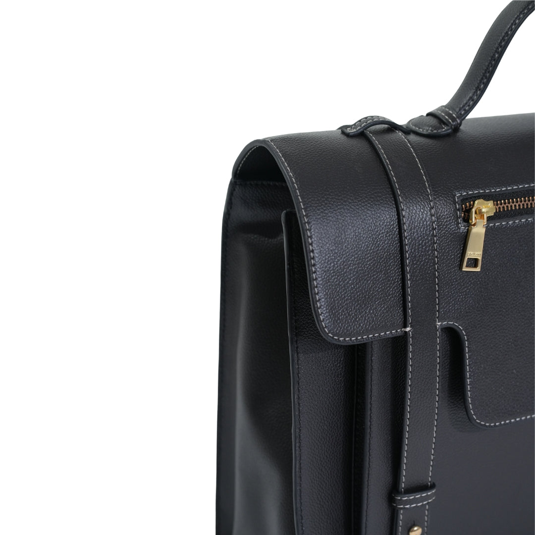Veganluxe Lifestyle Private Limited Munim laptop bag in black with adjustable shoulder strap and front pocket for storage.