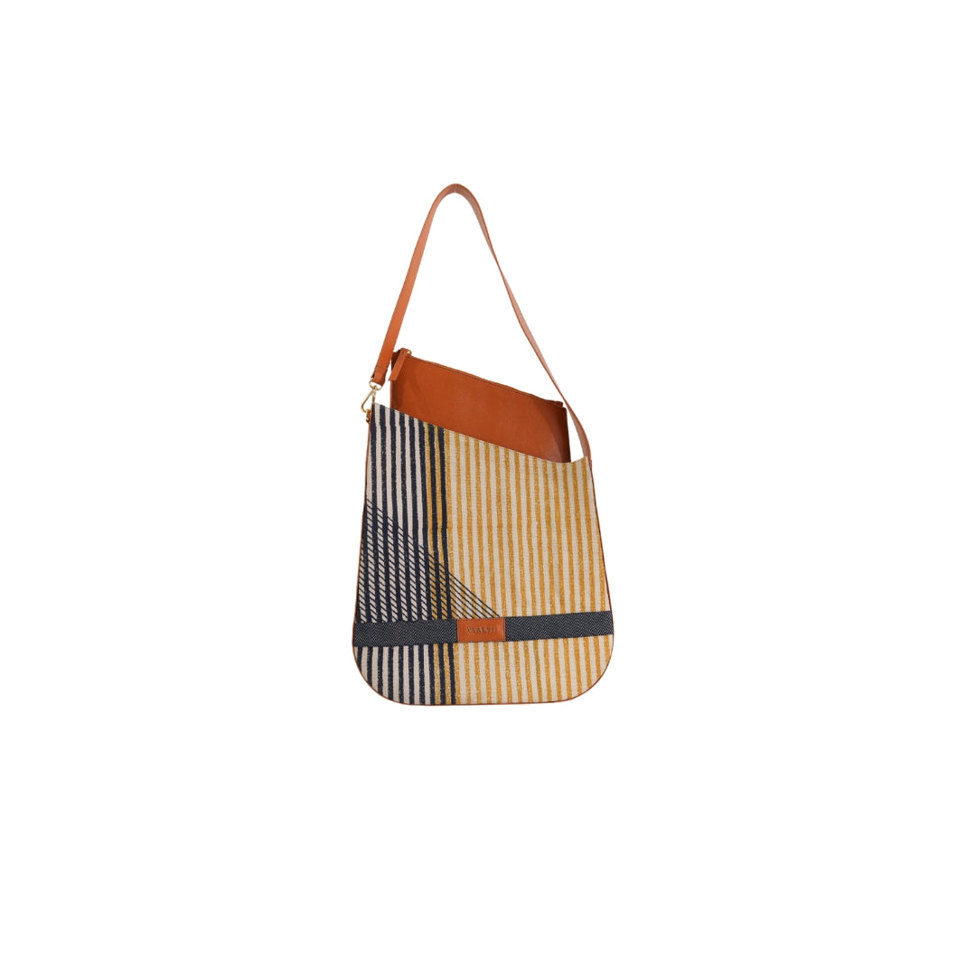 VYAKTI INDIA shoulder bag named Vessel, made of durable material with a sleek design, featuring a top zipper closure and adjustable strap.