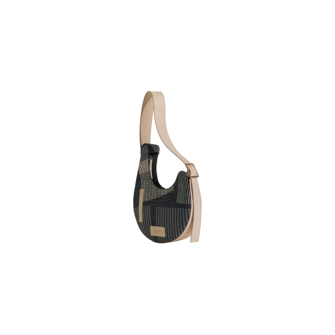 VYAKTI INDIA Dune shoulder bag featuring smooth leather and a sleek design, with a top handle and adjustable shoulder strap.