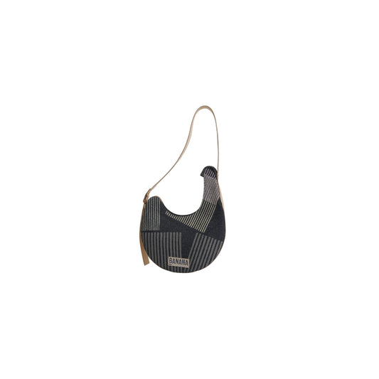 VYAKTI INDIA Dune shoulder bag with brown leather strap and textured tan surface, stylish accessory for everyday use.