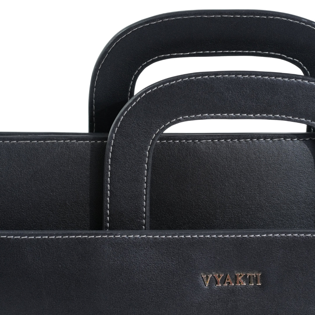 VYAKTI INDIA laptop bag briefcase with padded compartments and sturdy handles, designed for professional use.