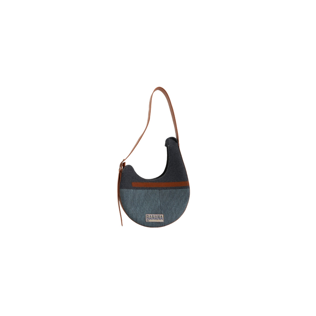 VYAKTI INDIA Dune shoulder bag with leather strap, sleek design, and textured surface, perfect for everyday use.