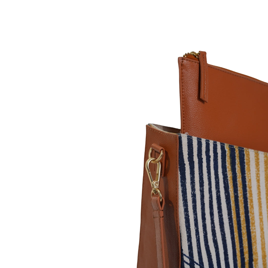 VYAKTI INDIA shoulder bag with vessel design, featuring brown leather and adjustable strap, stylish and functional accessory.